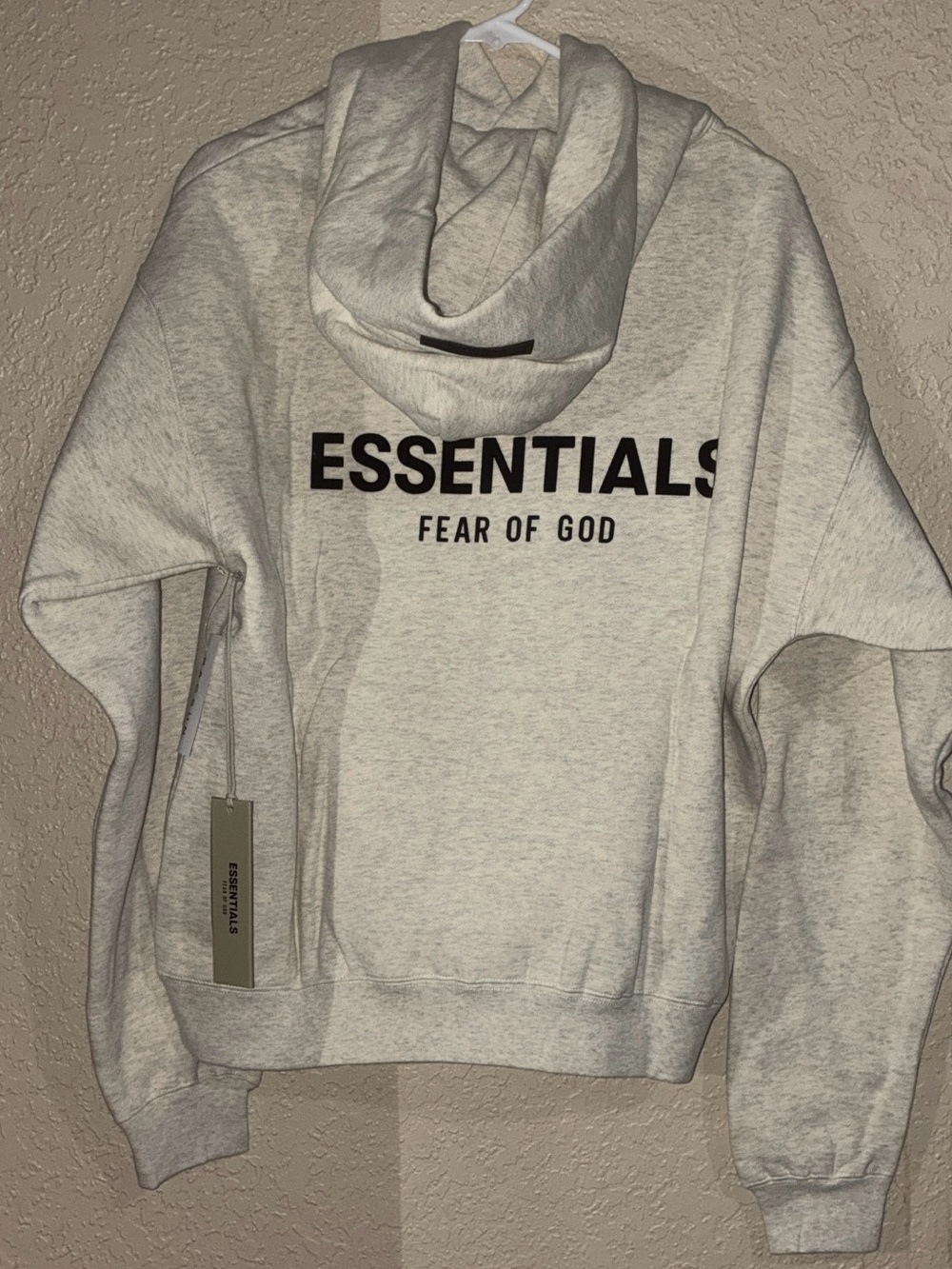 Hoodie with 'ESSENTIALS' and 'FEAR OF GOD' branding xs